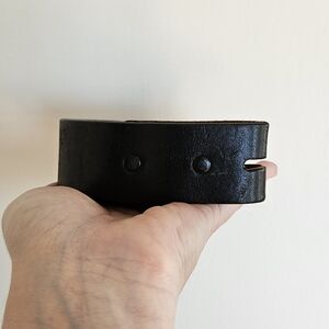 Black leather belt with black rivets, size 34